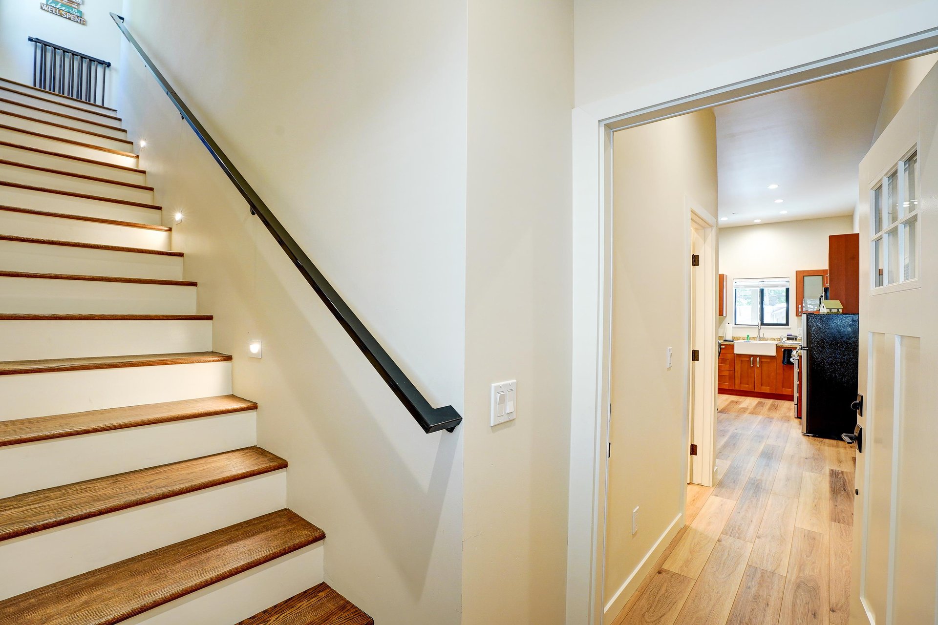 Stairs leading to second kitchen and living space.