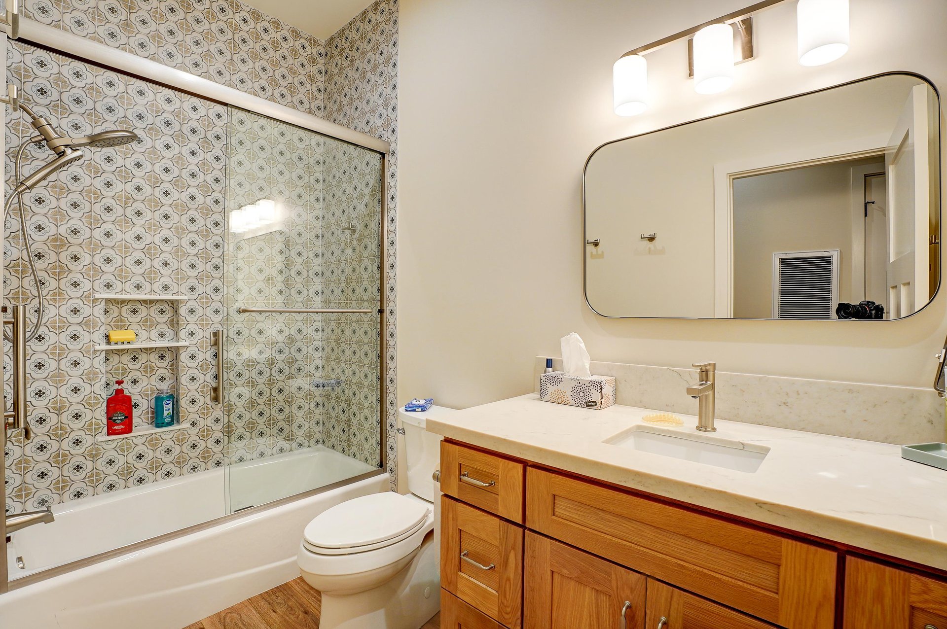 Showertub combination and modern fixtures.