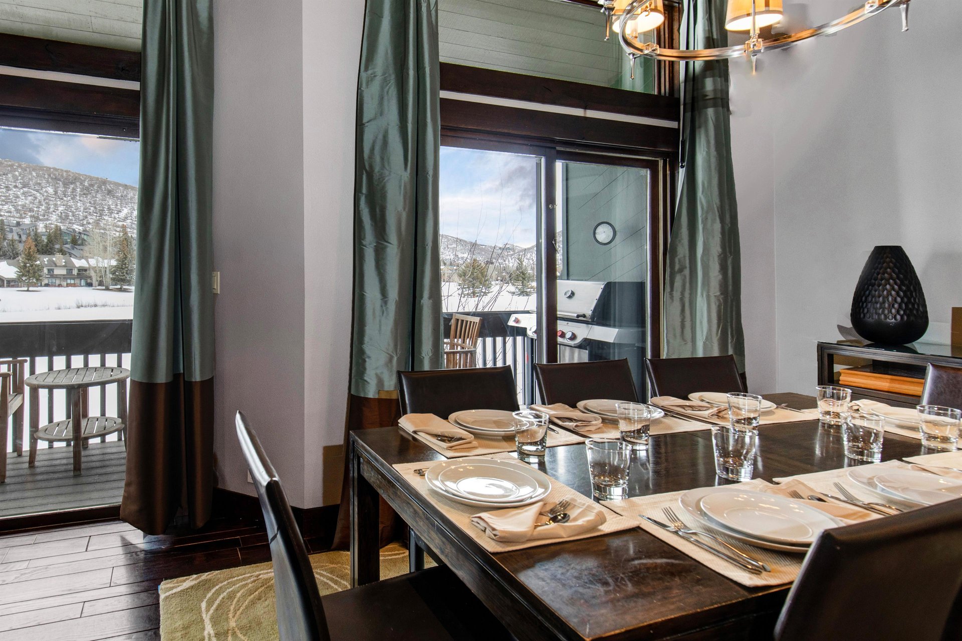 The dining area with seating and table settings for 8 guests.