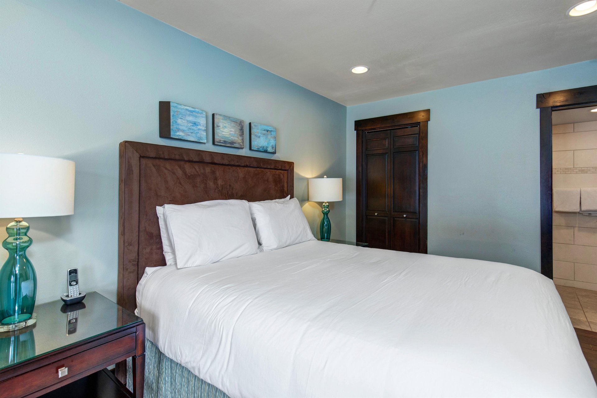 The bedroom with a queen size bed and wellappointed furniture.