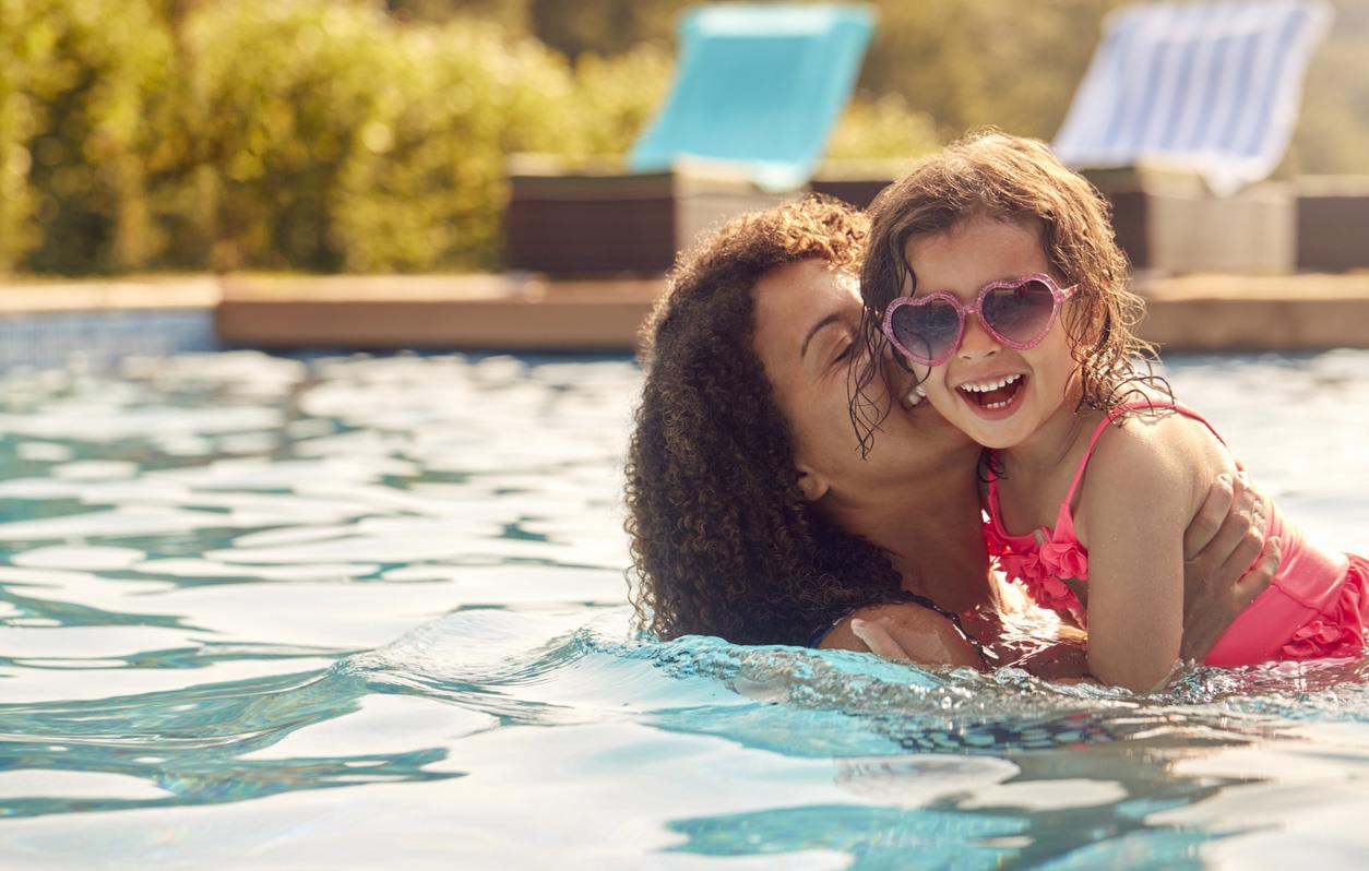 Park City Lodging is a premier provider of vacation rentals in the Park City, Utah area. Mom and daughter in a pool and playing together.