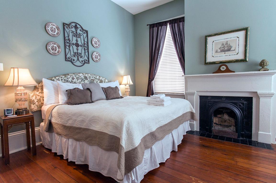 The third bedroom has a king bed with fluffy white duvet.