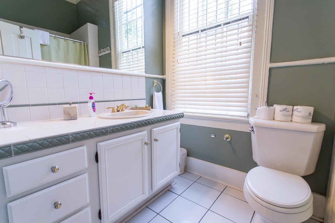 The first full bath has a tubshower combo.