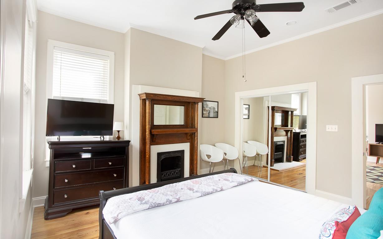 Original to the home, the decorative fireplace has been preserved to its natural state.