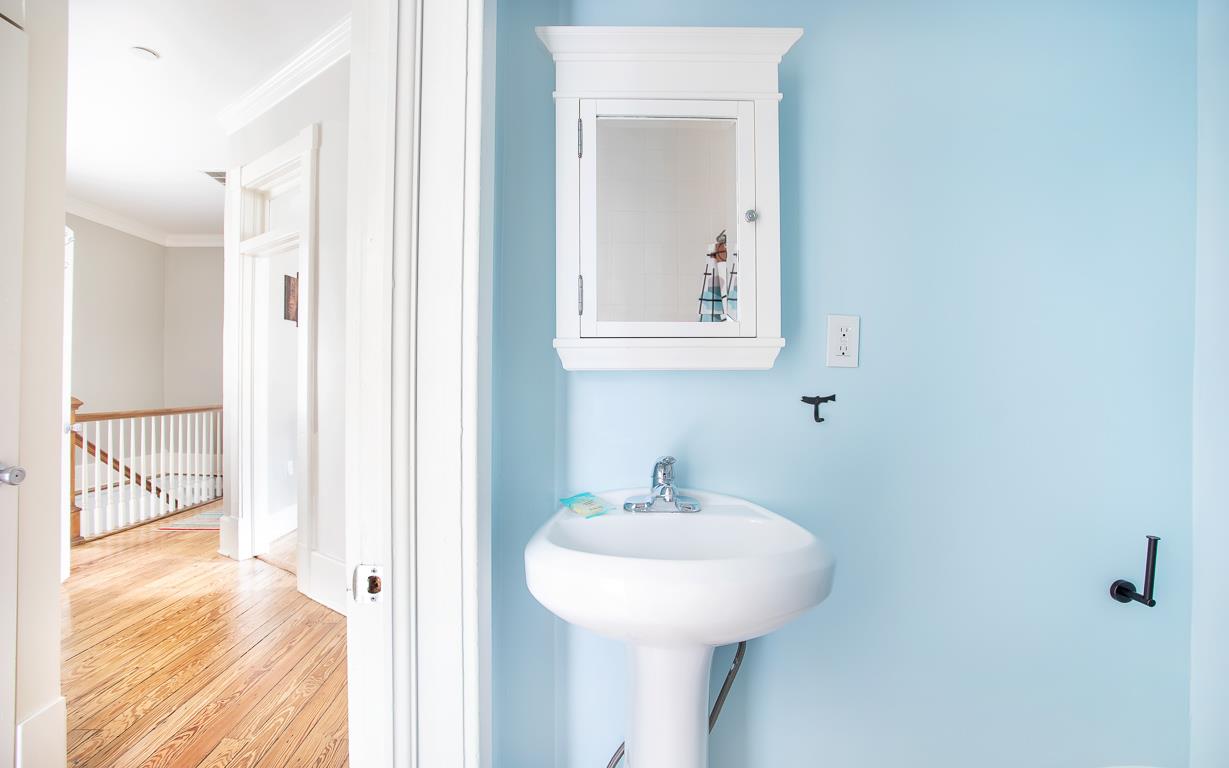 Across the hall from the queen size bedroom, you will find another full size bathroom.
