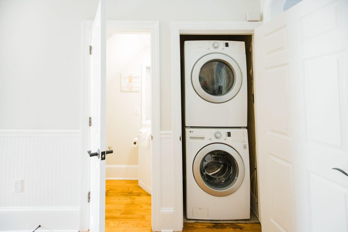 Also on the main floor, tucked beneath the stairs, a full size washer and dryer.