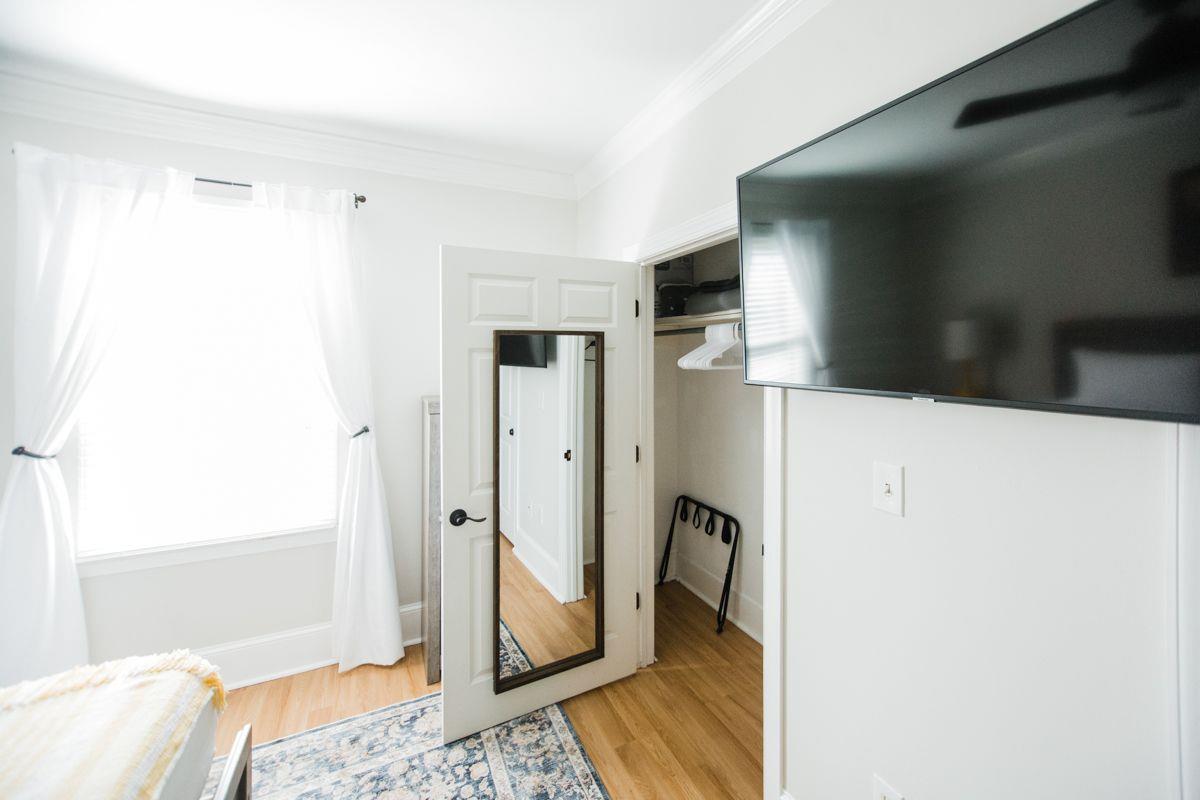 The closet space offers plenty of room to hang your clothes.
