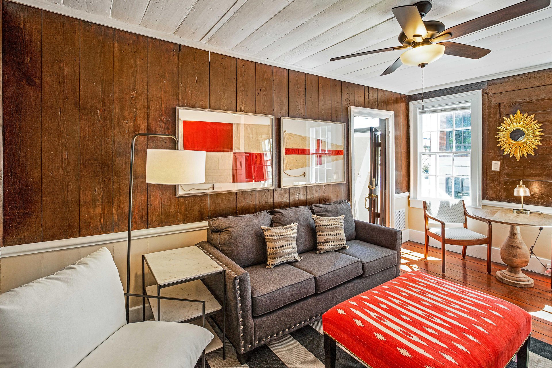 The bright living room features Scandinavian style decor.