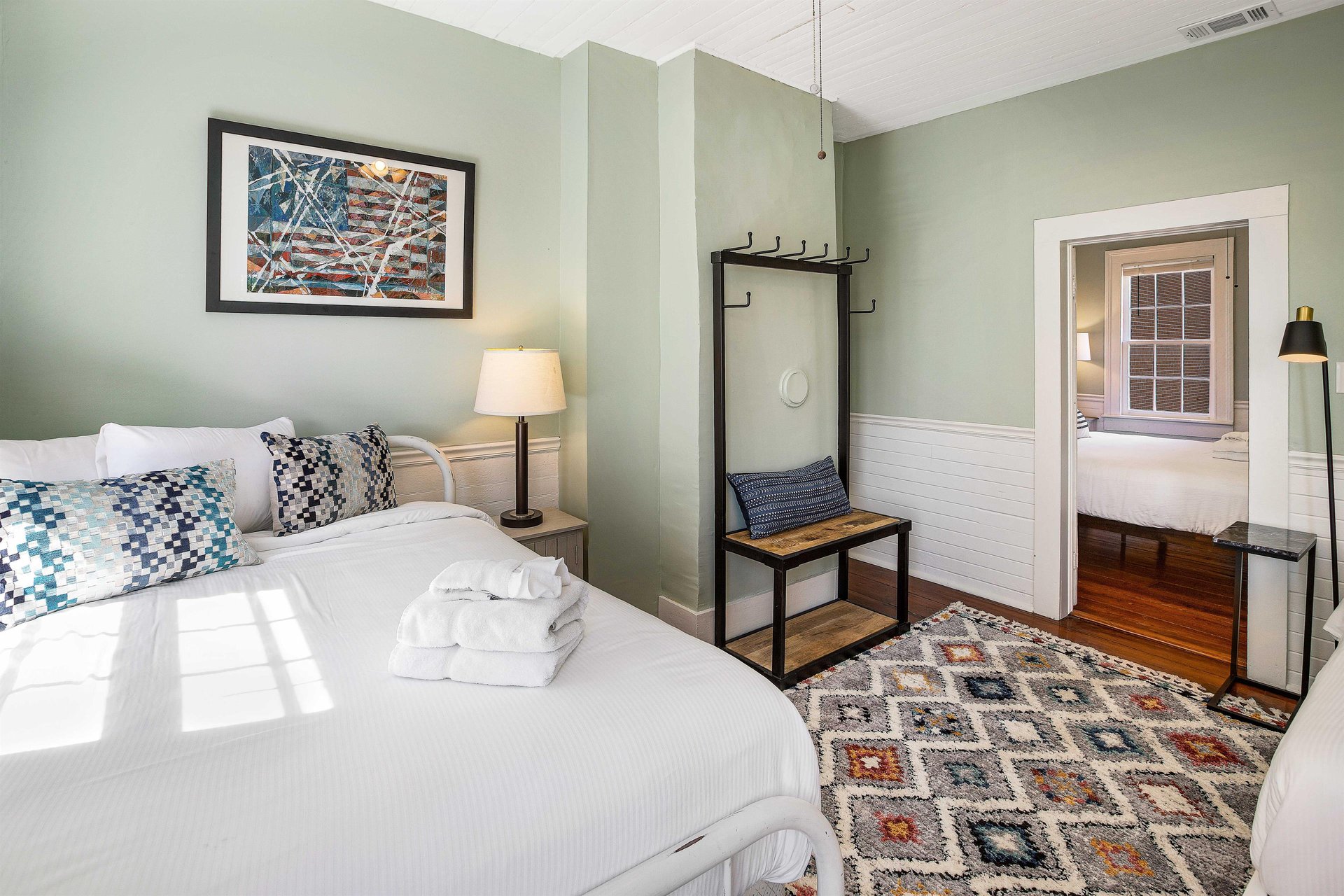 Heading across the hall, youll find the third bedroom, that connectscloses off to the fourth.