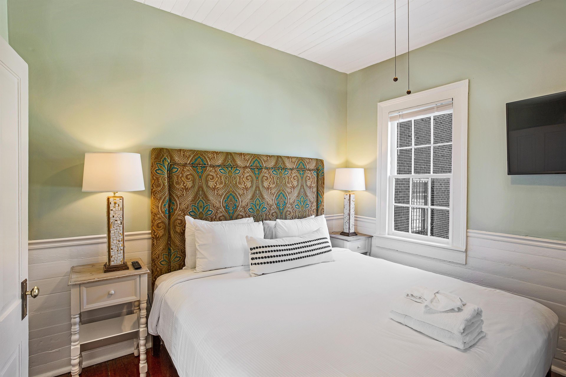 Heading across the hall, youll find the fourth bedroom.