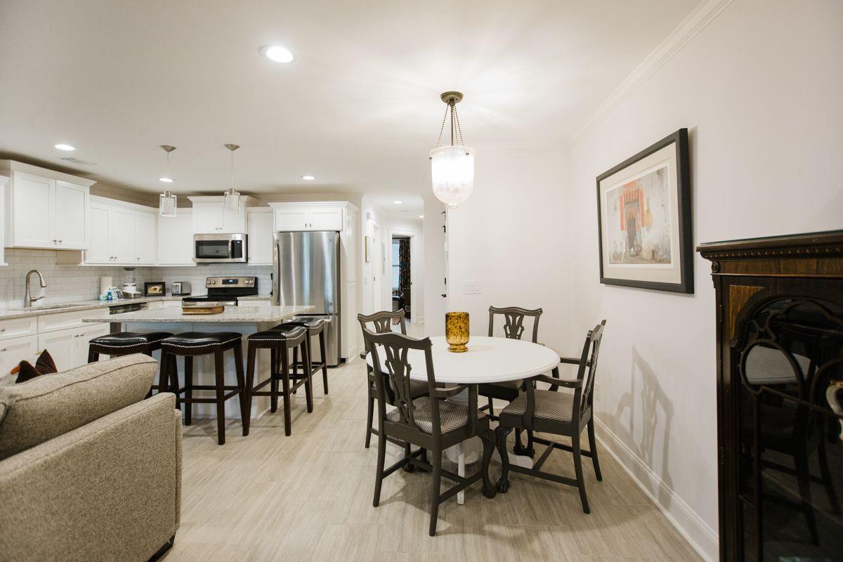 A dedicated dining space is open to the kitchen and living.