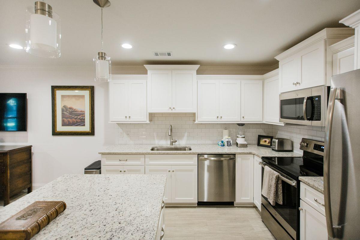 This kitchen offers stainless steel appliances, and an ample amount of cookware to prepare meals.