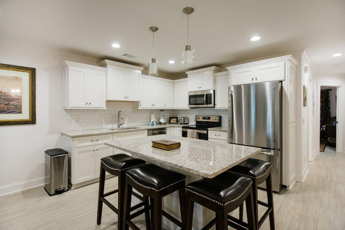 Additional seating can be found at the large kitchen island.