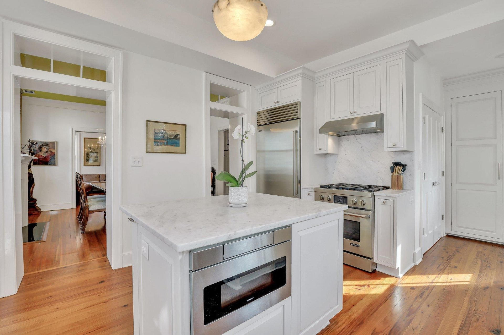 Marble countertops are carried throughout the kitchen, along with topoftheline stainless steel appliances.