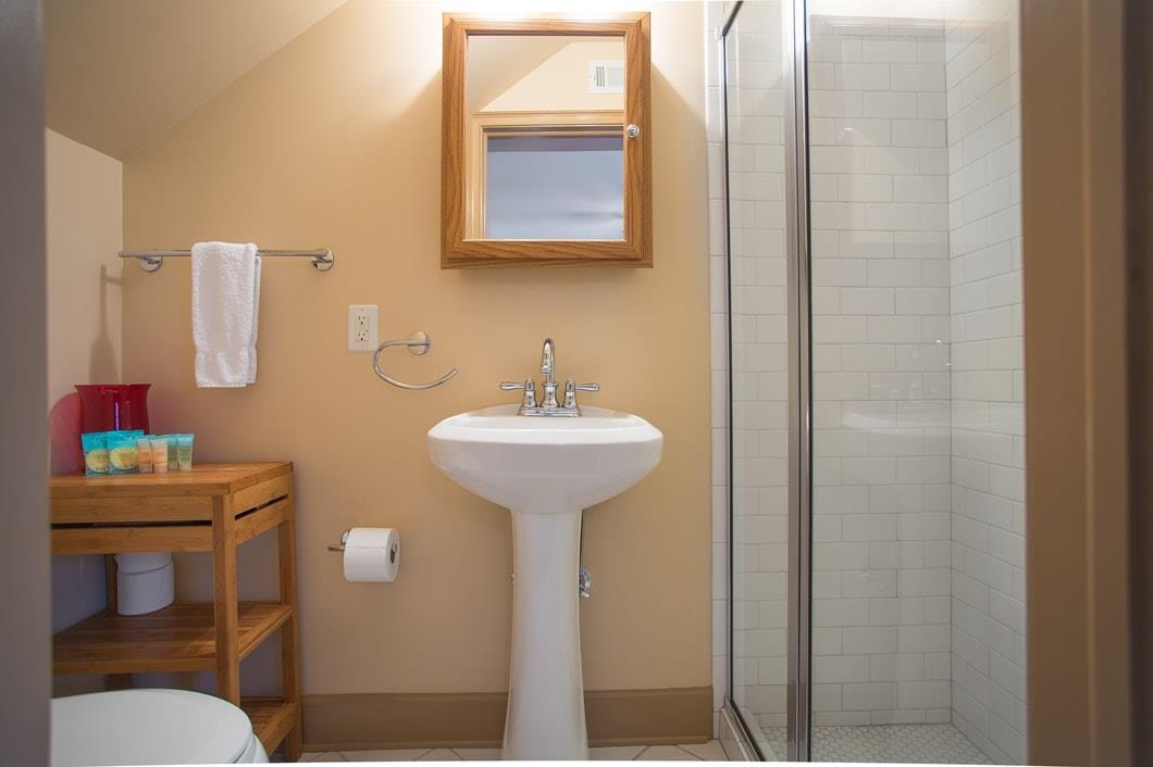 Second bathroom on the garden level with stand up shower.