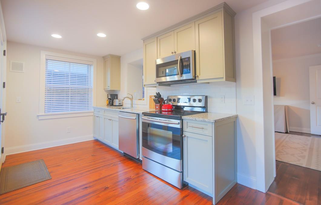 This brand new kitchen boasts modern cabinetry and new appliances.