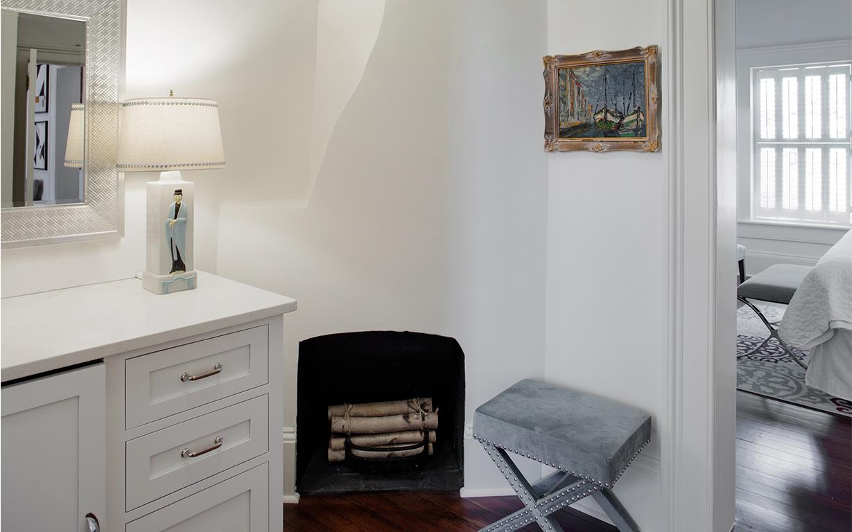 Moving over to the second suite, guests can find a decorative fireplace and another place to mix drinks.