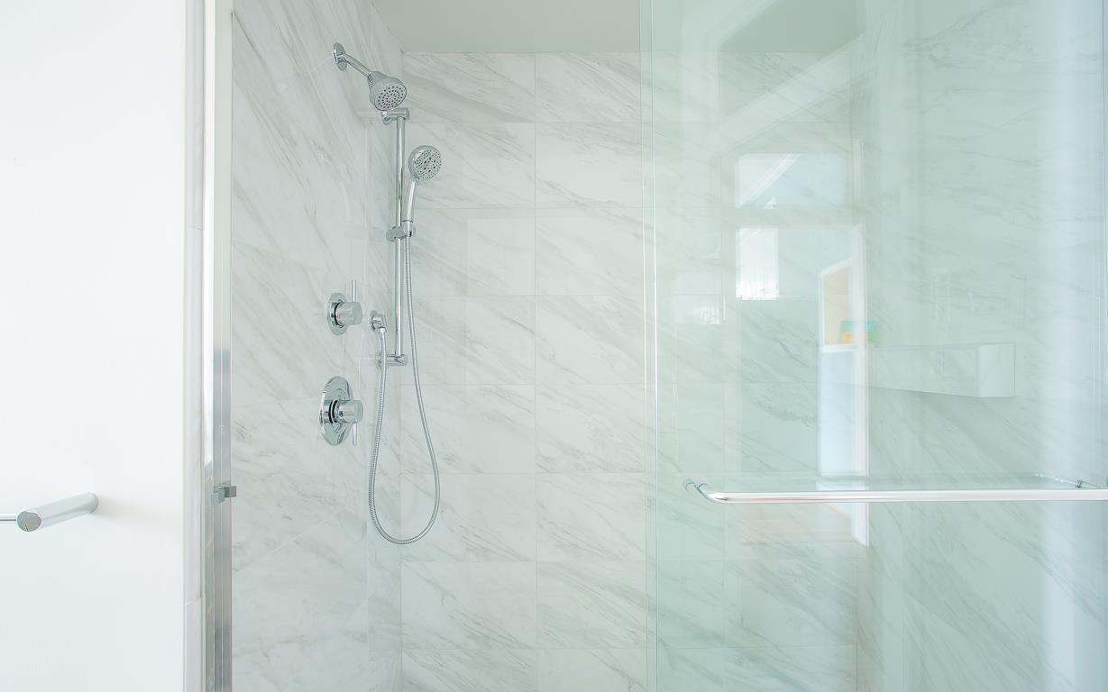 Unwind after a long day in this luxurious tiled shower.