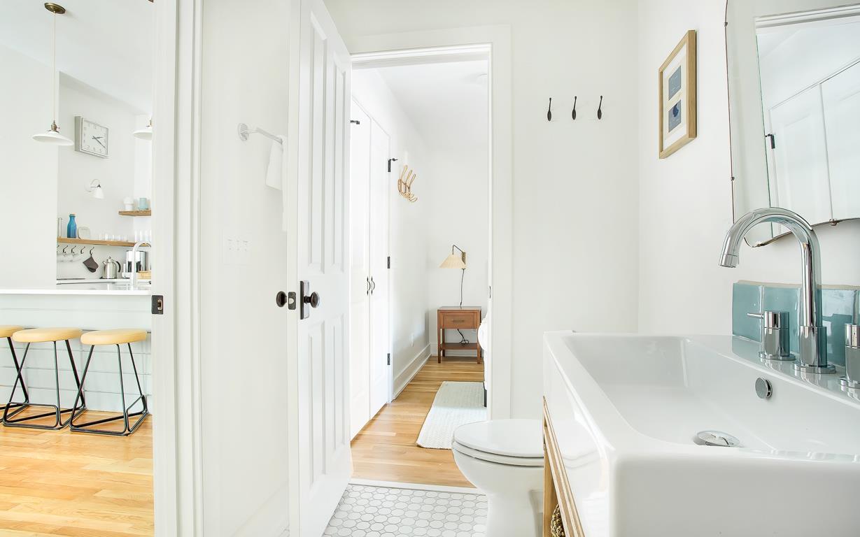 A full bath is en suite, with jack and jill doors to the living room.
