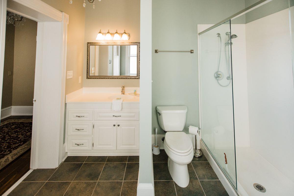 A spacious walkin shower is just adjacent to the soaking tub.