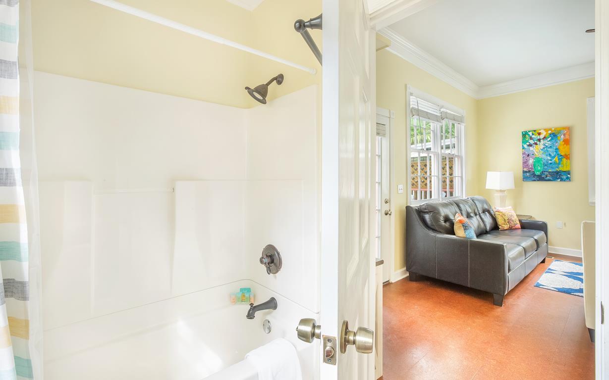 A full bath with tubshower combo is adjacent to the living room.