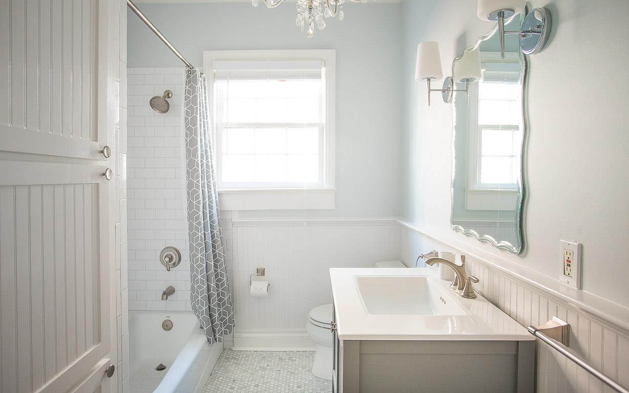 Guests can enjoy a full bath behind the stairs.