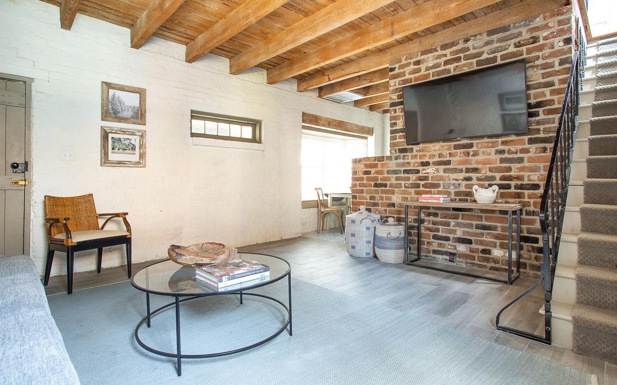 A large Smart Television has been placed in the living room  perfect after a day of exploring the city.