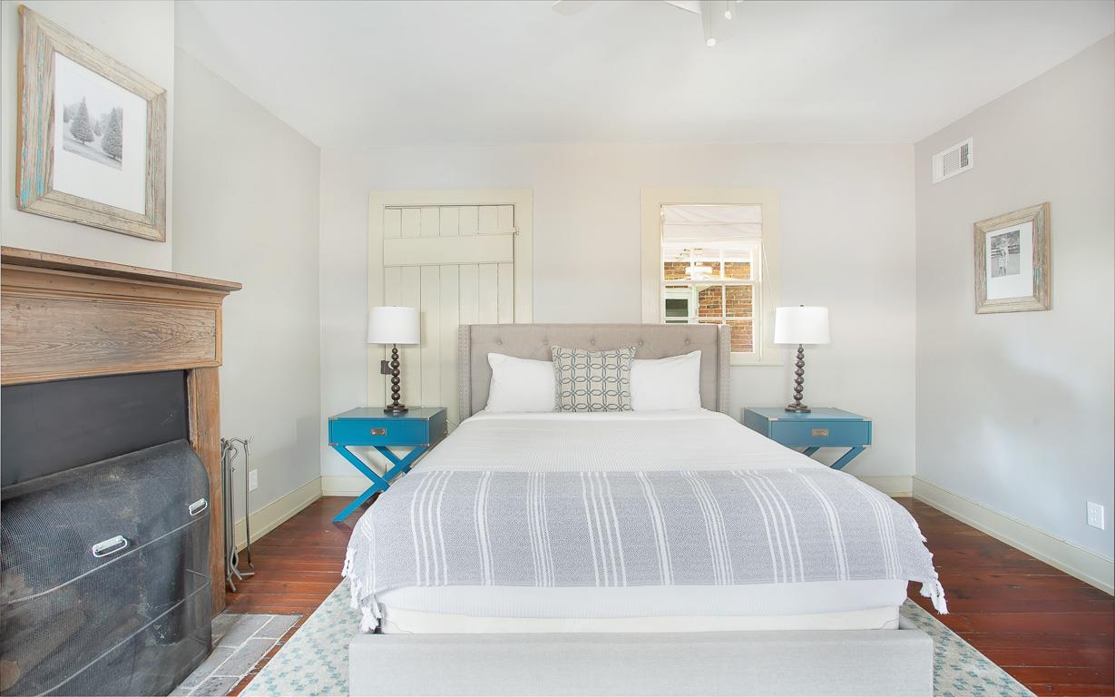 At the end of the hall, you will find the primary bedroom.