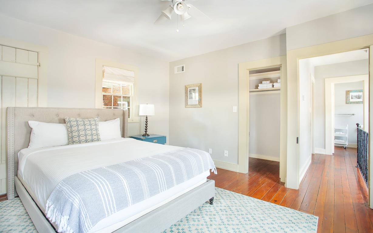 A queen size bed is offered, along with a large walkin closet.