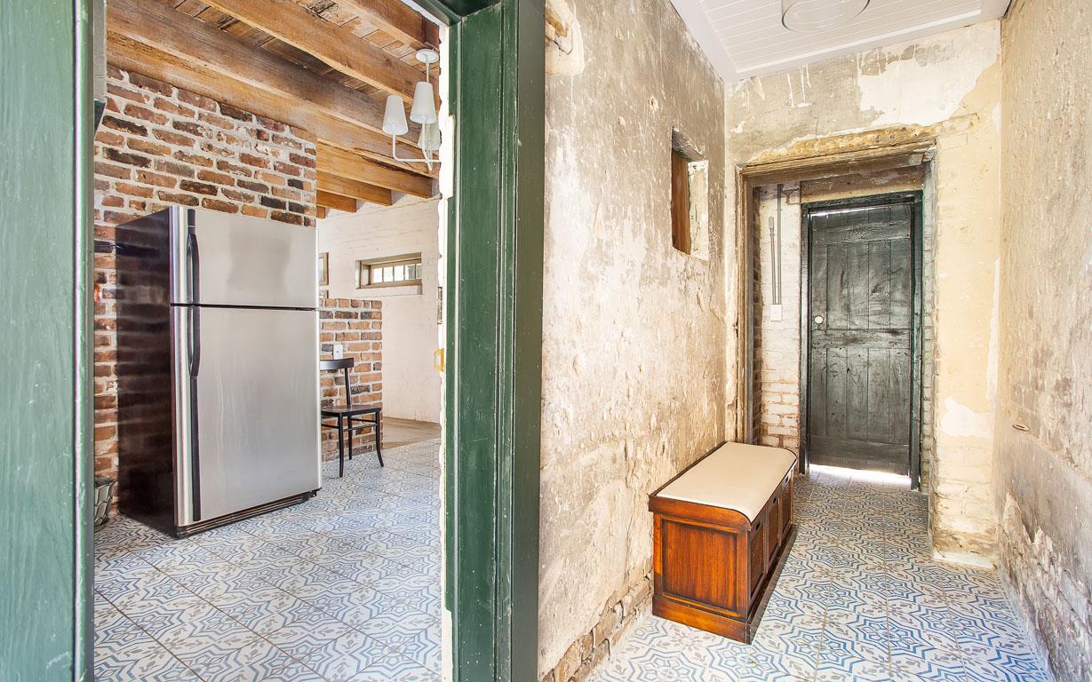 Enter immediately into the kitchen, where the mosaic tile is carried throughout.