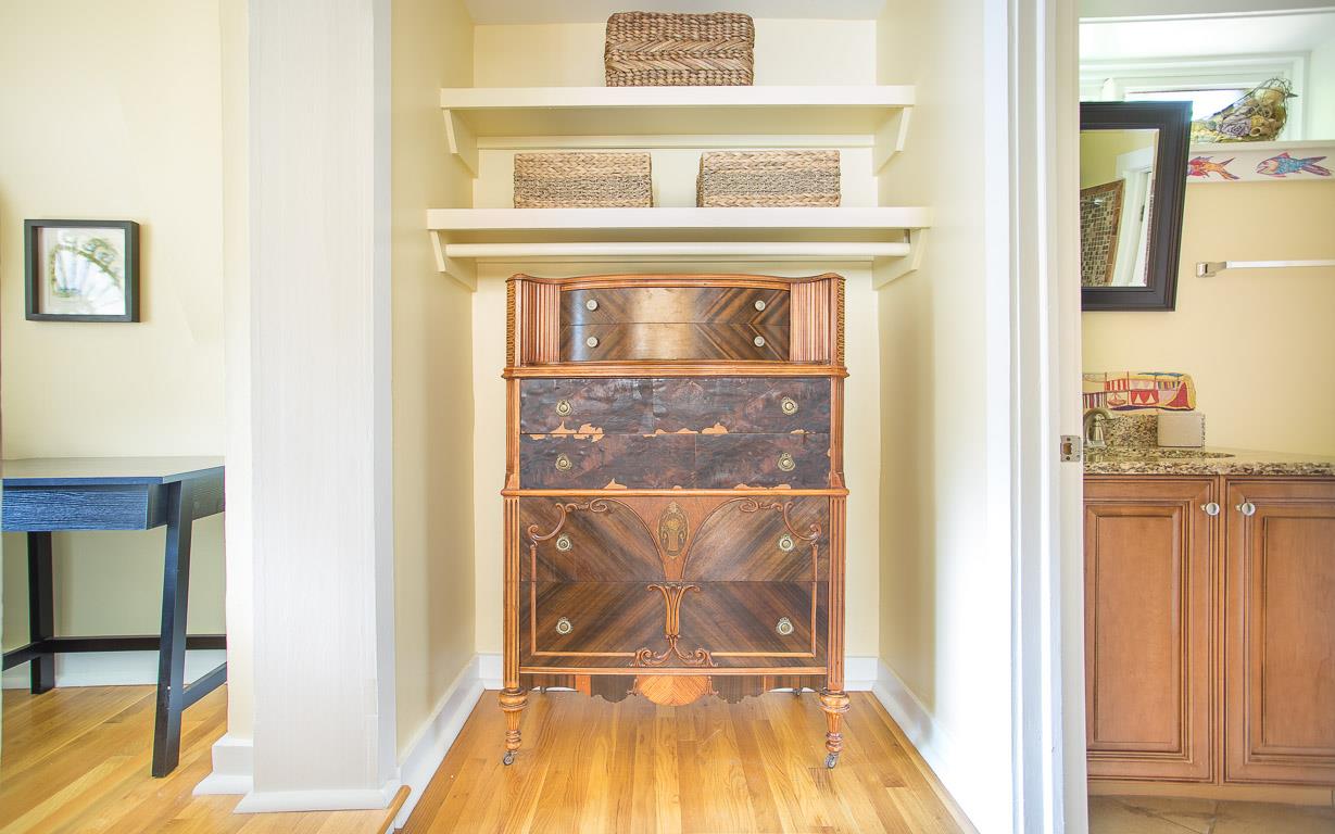 Enjoy this antique chest between the bedroom and bath.