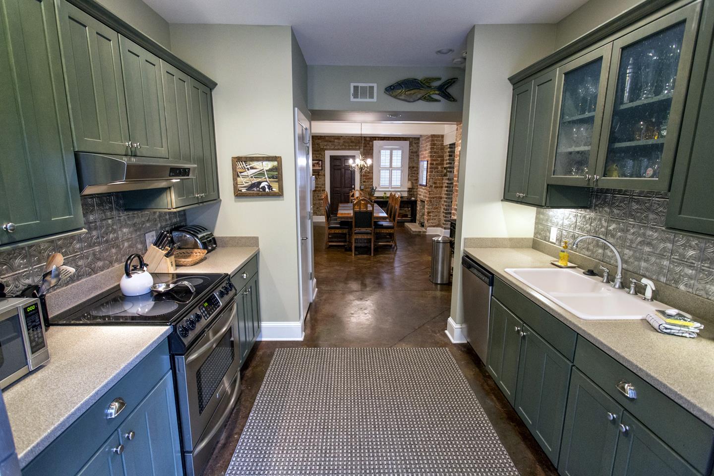 Serve dinner easily in the dining room with adjacent kitchen.