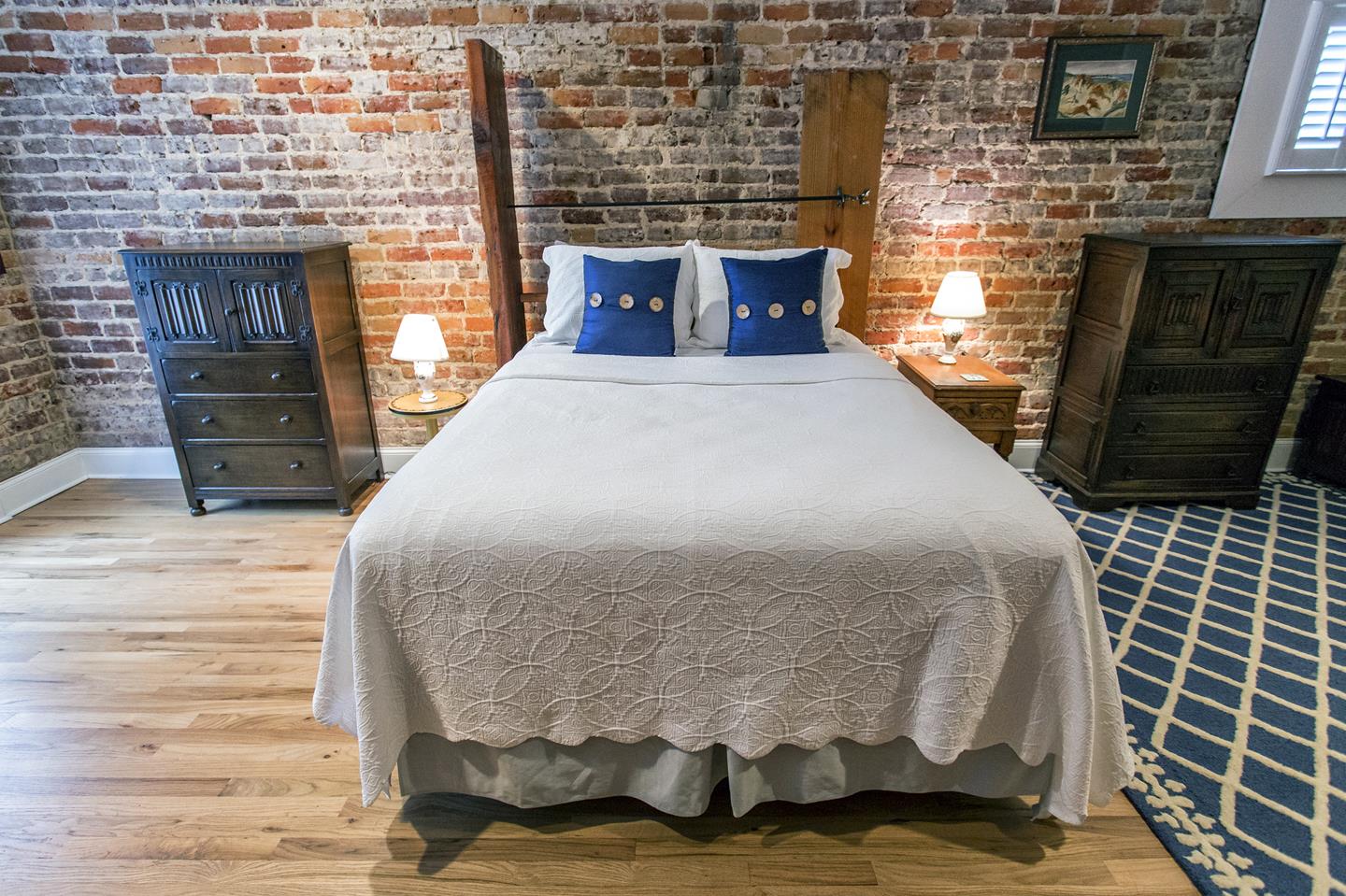 Industrial touches with warm bedding are hard to leave.
