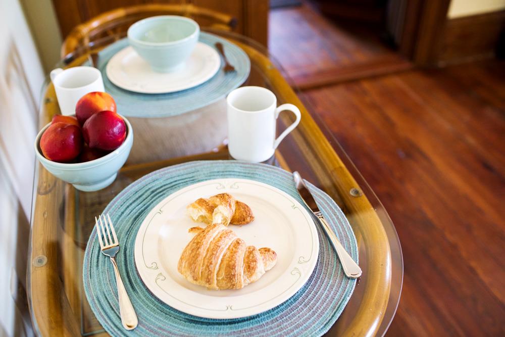 The breakfast table comfortably seats two.