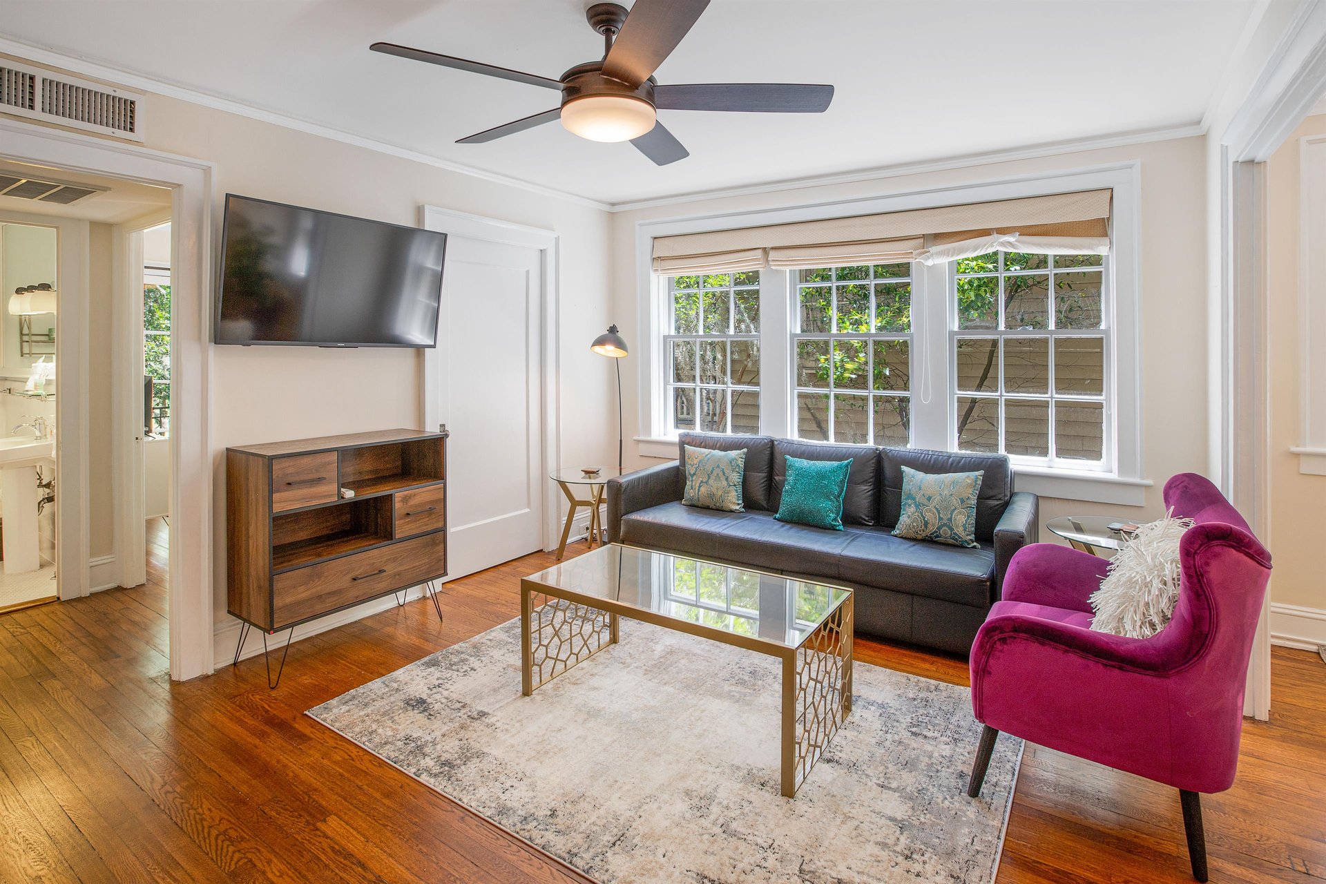 Located on the second story of this historic apartment building, the space boasts with natural light.