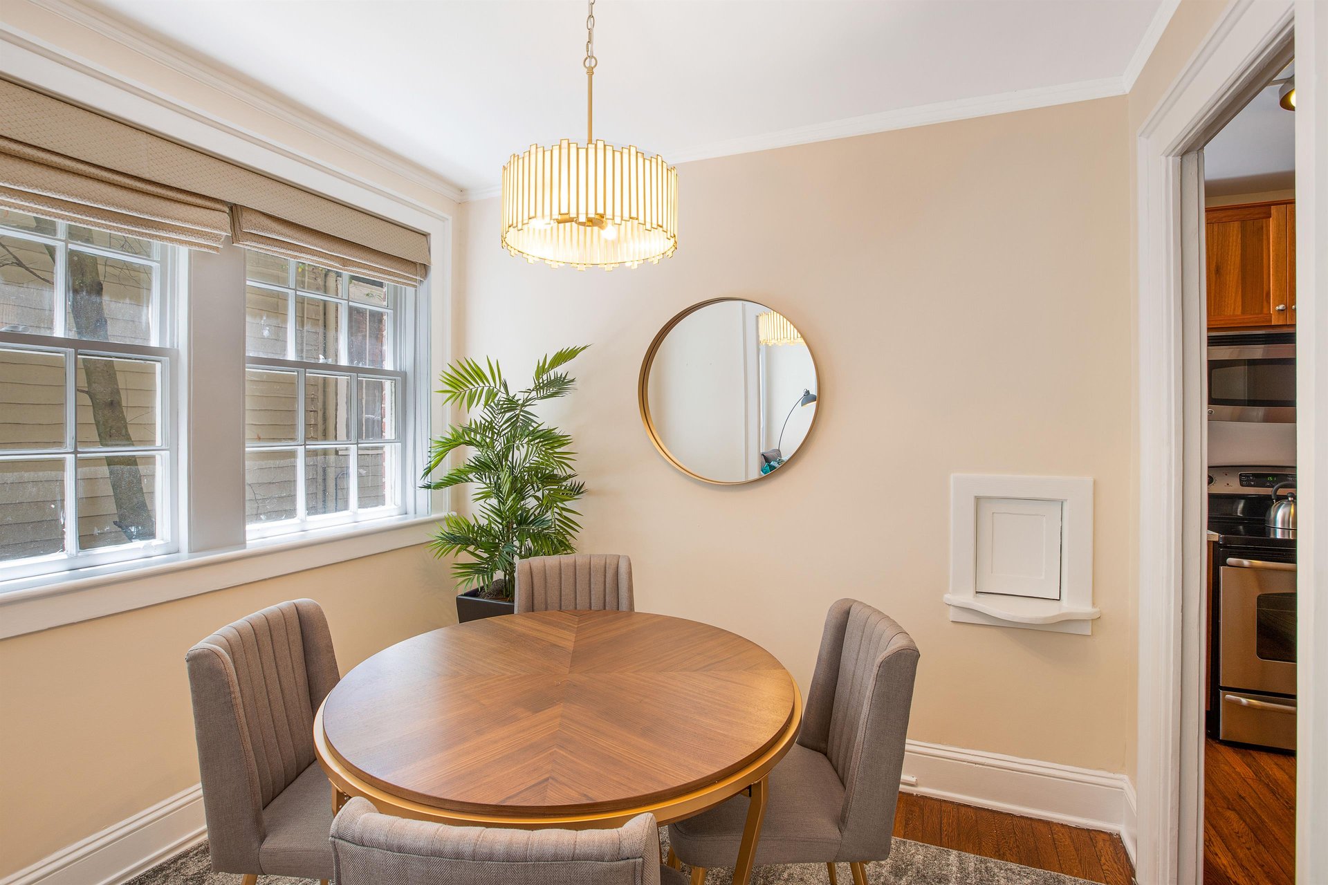 Gold accents pair well with the original pinewood flooring, and mahogany table.