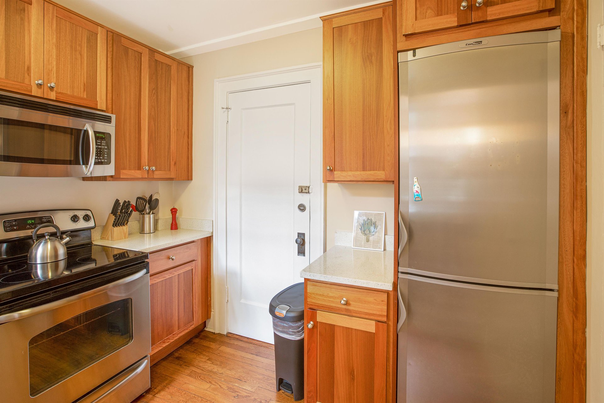 This quaint kitchen is packed with all of the necessities needed to prepare home cooked meals.