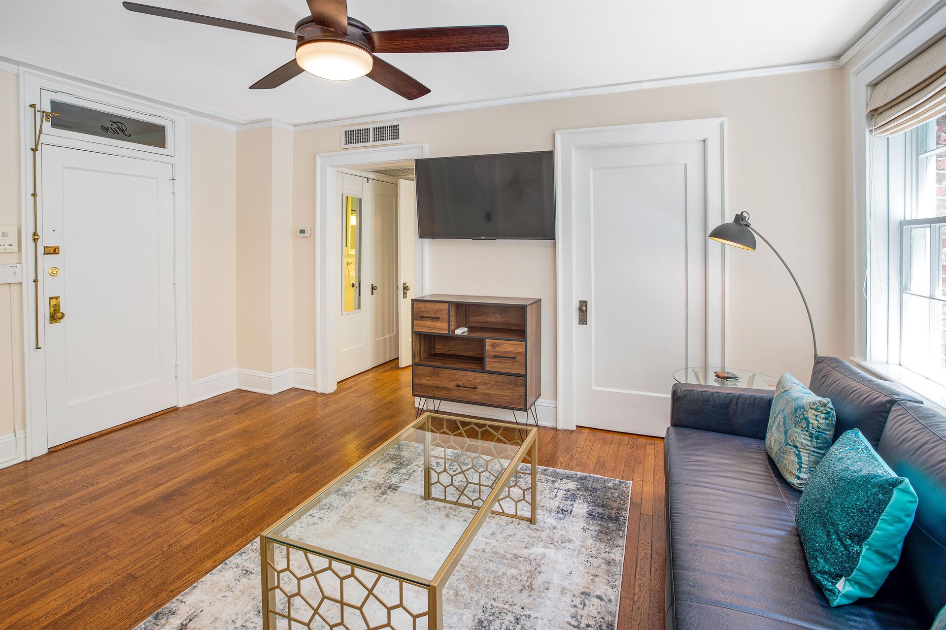 The living space features a large smart television, and a sleeper futon, for those who may have a guest visit.