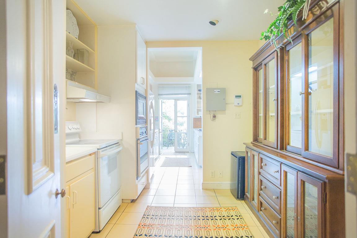 Dishes and glassware are stored in the cabinet.