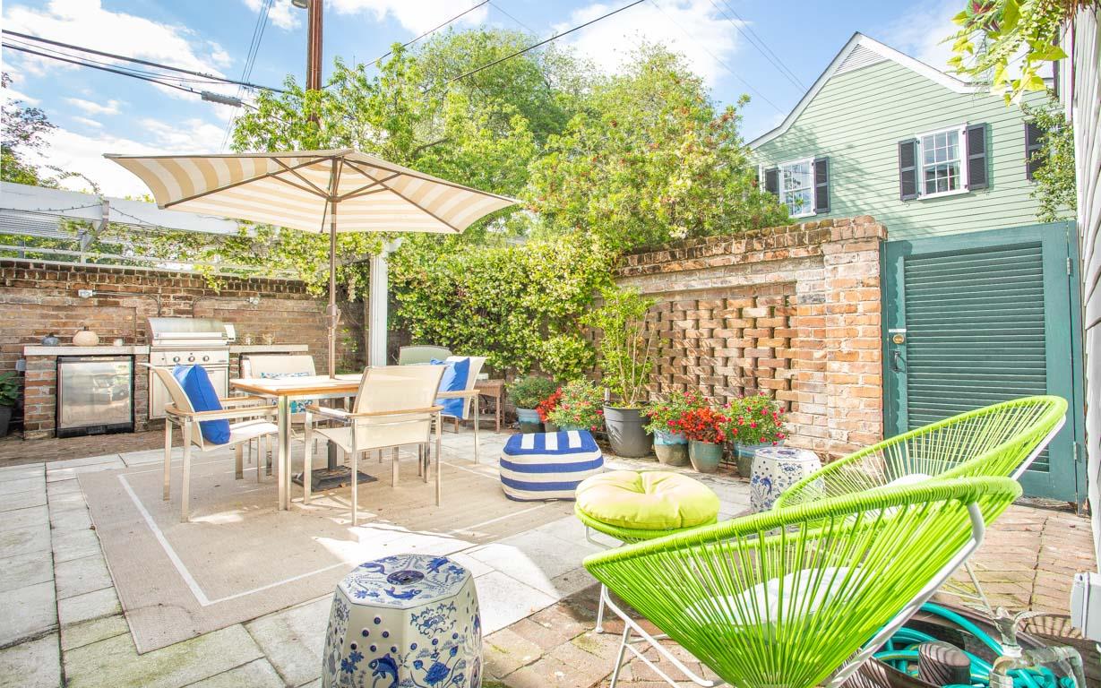 The private back courtyard with builtin grill and refrigerators.