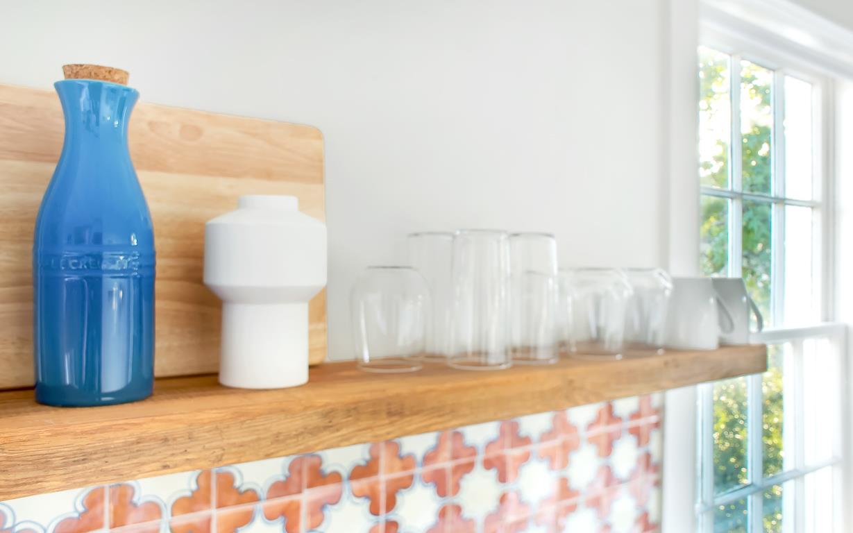 Dishes, utensils, and dish soap are provided.