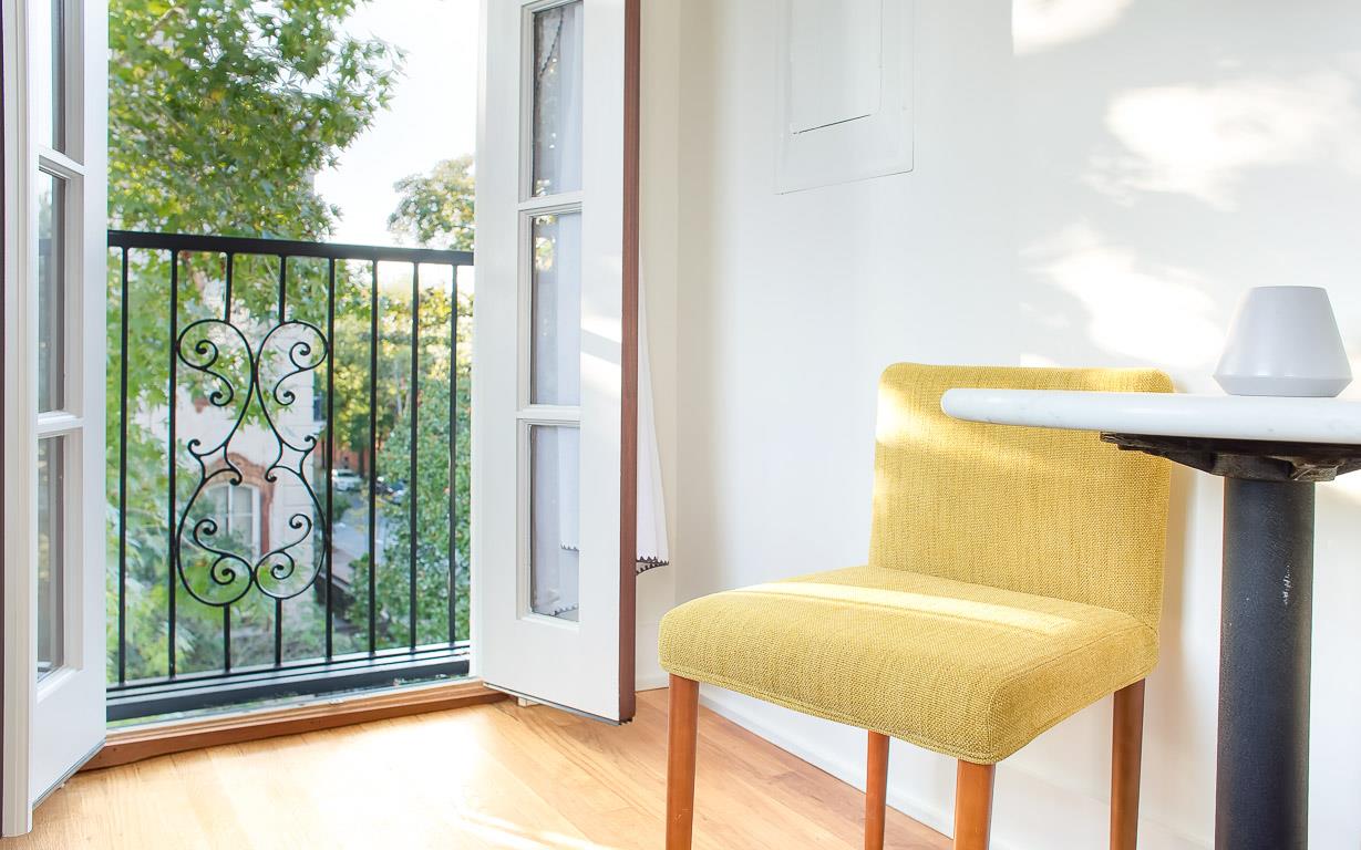 Open the French doors and enjoy views from the balcony.