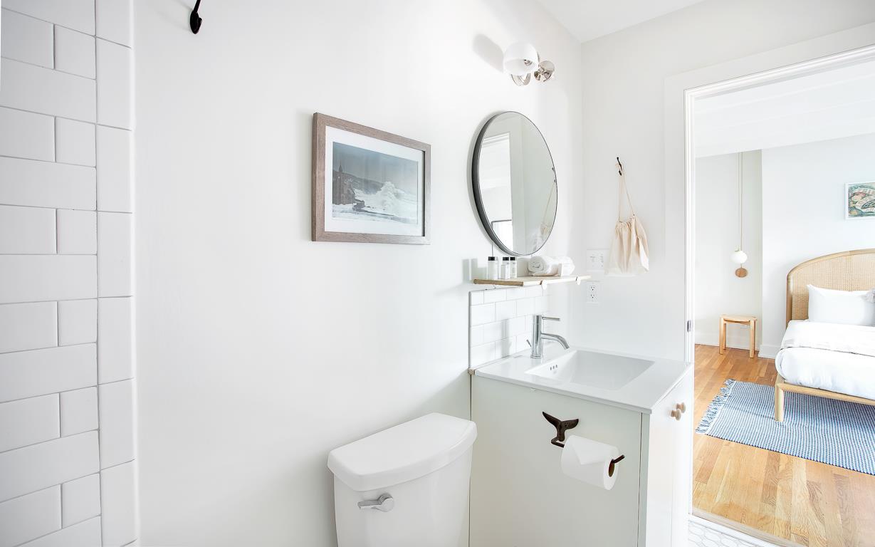 The full bath is adjacent to the bedroom.