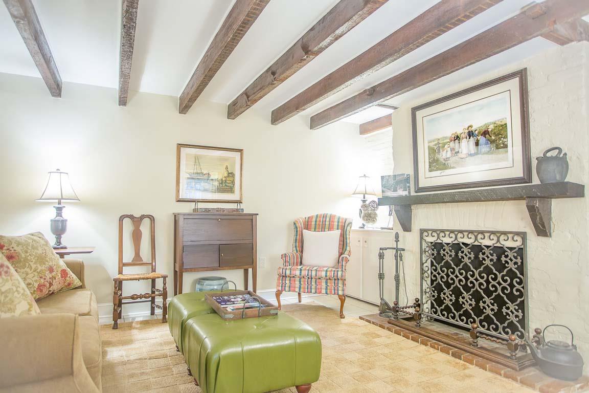 Bright walls and exposed beams bring character to the home.