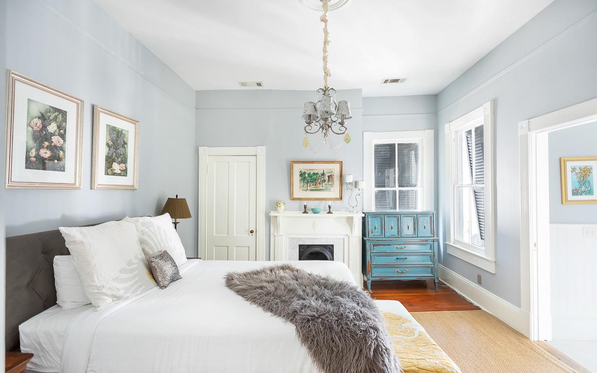 The primary bedroom offers a decorative fireplace, dating back to 1900.