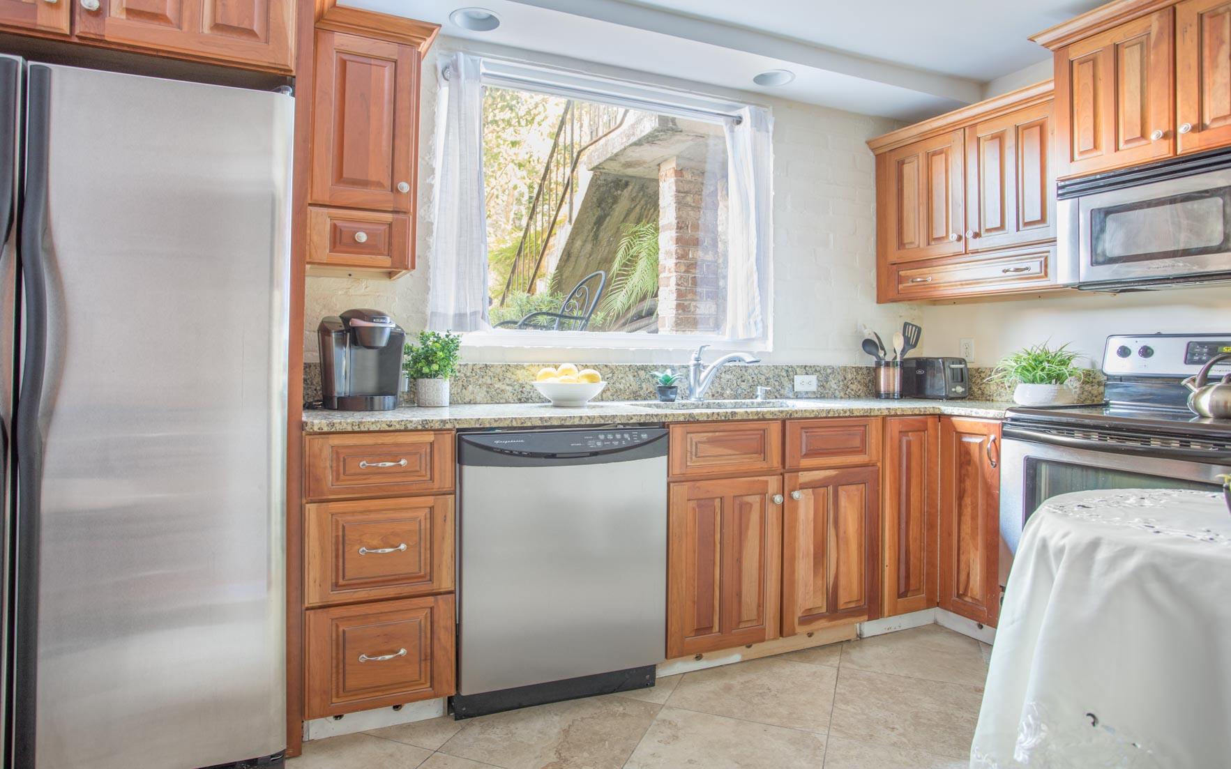 The bright and sunny kitchen is equipped with everything you39d need.