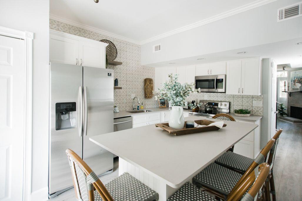 The large kitchen island is ideal for prepping meals, and can seat all six of your guests.