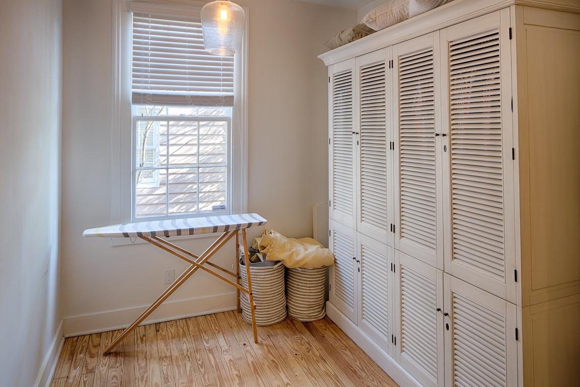 Feel at home with this large closet and ironing area.