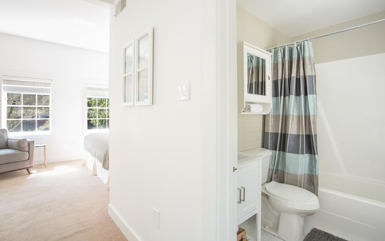 View of the bath and adjacent bedroom.