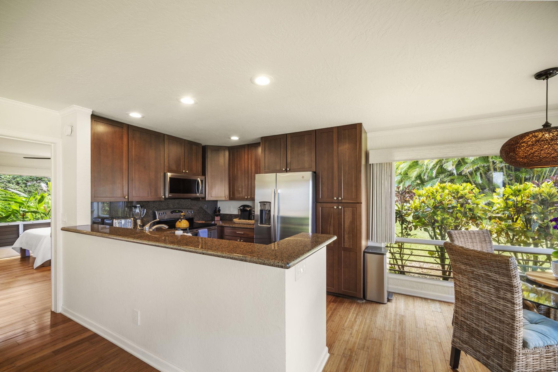 Kitchen and dining room with the guest room on the left